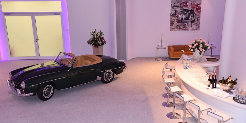 Classic car showroom with organic shapes